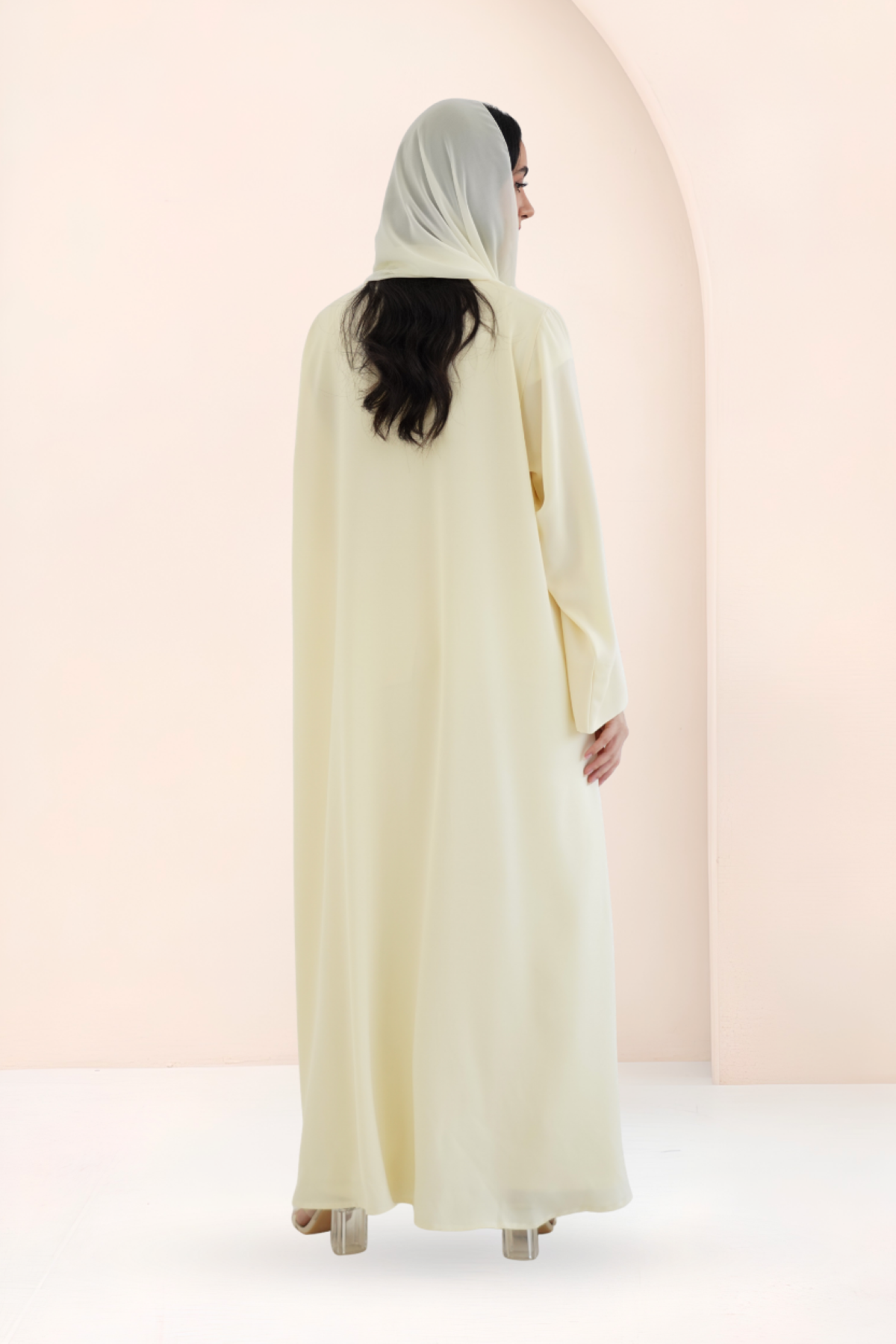 Back view of Riwa mango yellow 2-piece abaya set with chiffon sheila

