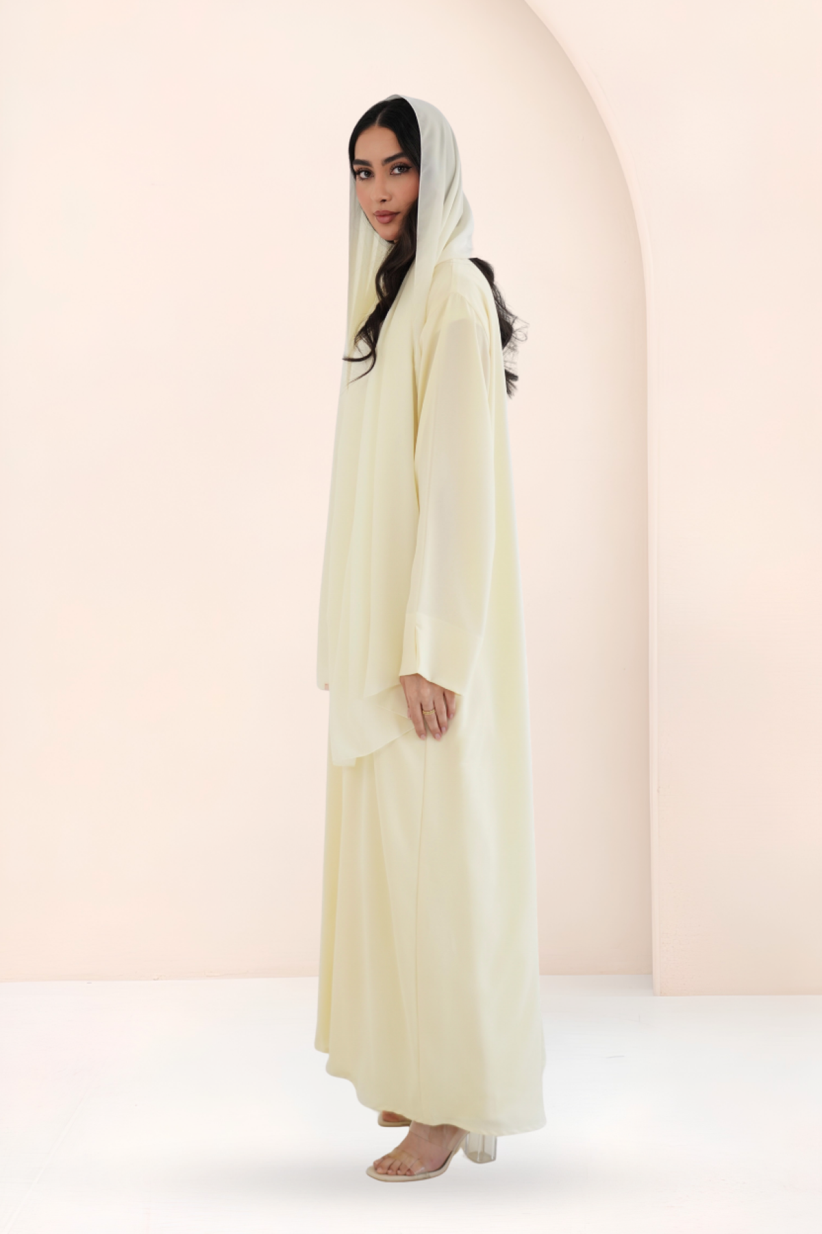 Side view of A-line mango yellow Nidha abaya with open front