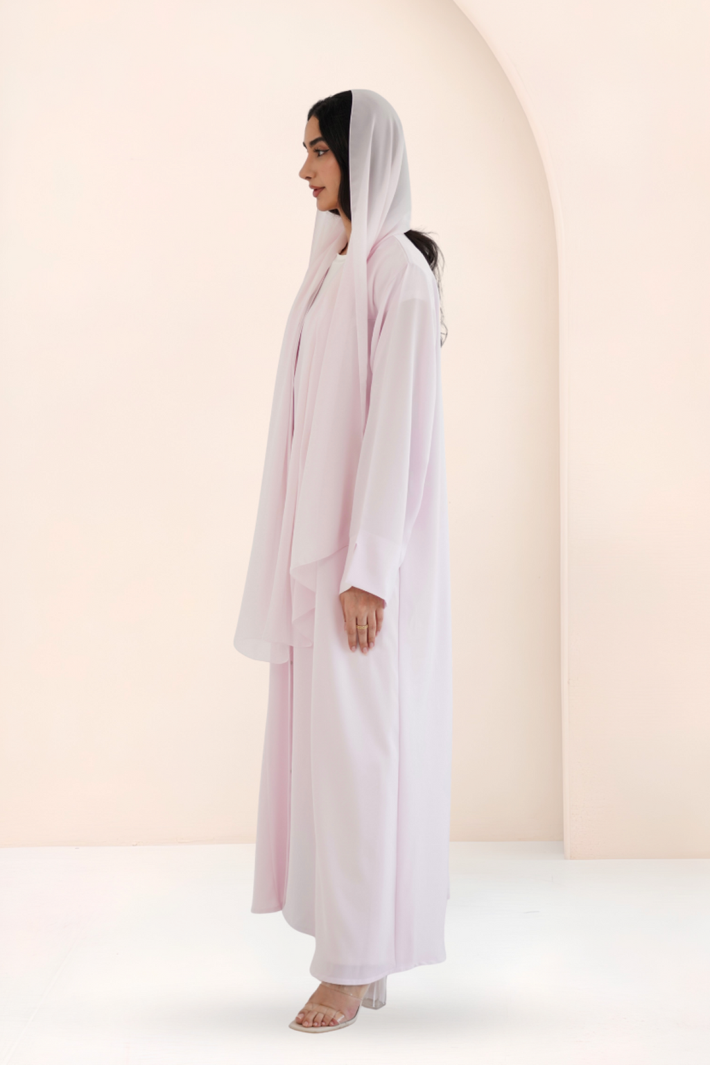 Side view of A-line rose pink Nidha abaya with open front
